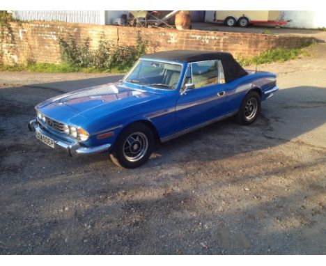 A 1976 Triumph Stag, registration number UCW 606R, blue. This manual overdrive Mk II Stag has been lightly recommissioned and