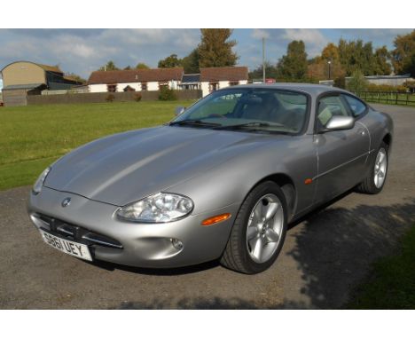 A 1998 Jaguar XK8 coupé, registration number S861 UEY, silver. Jaguar's new grand tourer was launched in 1996 with coupé and 