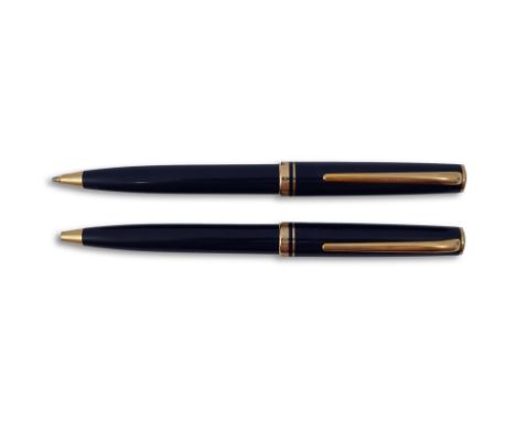 A Montblanc Generation ballpoint pen and propelling pencil set in blue with gold trimsPLEASE NOTE:- Prospective buyers are st