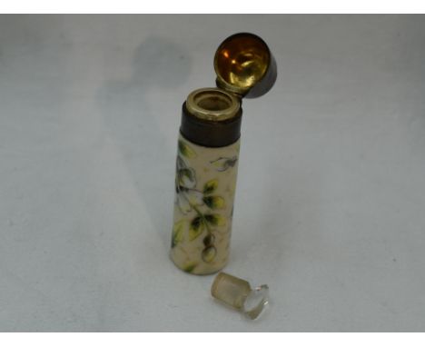 A Victorian ceramic scent bottle having floral and gilt heightened painted decoration, glass stopper and plain hinged lid, Bi