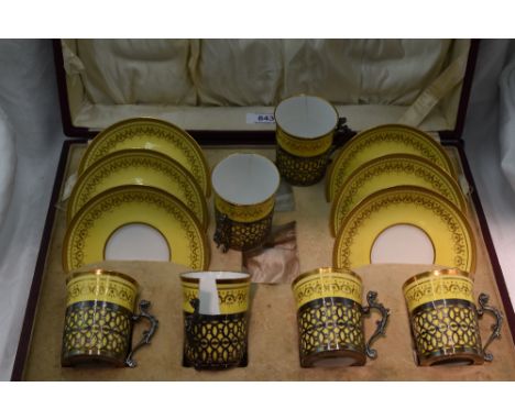 A cased set of six silver mounted Copeland Spode coffee cans and saucers having gilt decoration to yellow ground, Birmingham 