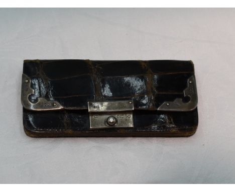 A small Edwardian brown leather coin purse having silver fitments, London 1902 &amp; Birmingham 1902 bearing import mark