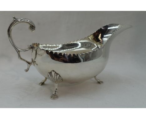 An Irish silver sauce boat having indented rim, loop handle &amp; trefoil hoof feet, Dublin 1971, Royal Irish Silver Ltd,  ap