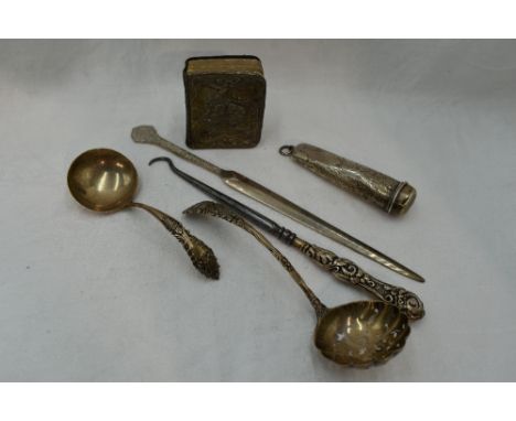 A small selection of HM silver including ladle, sifting spoon, paper knife, silver backed miniature prayer book, cigarette ho