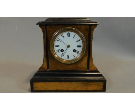 A 19th century walnut and ebonised mantel clock, circular enamel dial with Roman numerals with pendulum. 23x23.5cm 