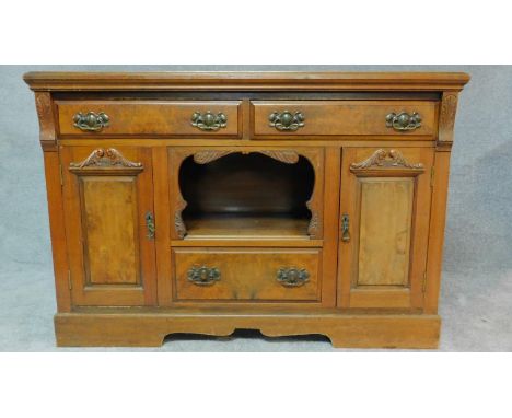 A late Victorian carved walnut sideboard fitted drawers and cupboards on bracket feet. H.94 W.137 D.50cm 