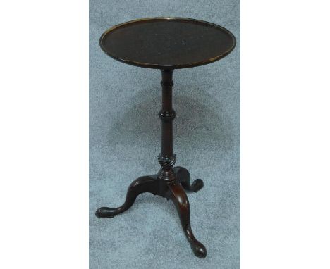 A 19th century mahogany wine table on tripod cabriole supports. H.65cm 