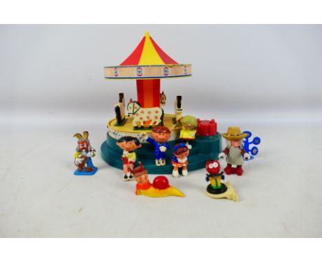 Corgi - An unboxed Corgi #852 Magic Roundabout Carousel. The Carousel comes with a quantity of figures and has some fading to
