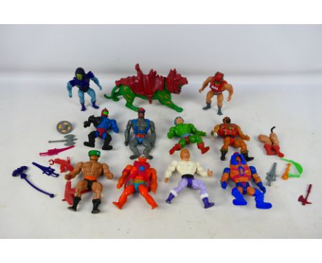 Mattel - An assortment of 11 He-Man action figures in mostly good condition. Includes Prince Adam, Skeletor, Jitsu and other.