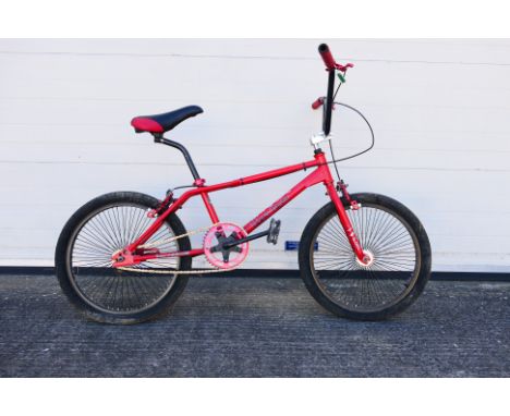 Harro - An unboxed Harro SFT red bike measuring; frame 12", wheel size 20". Item has signs of use; tyres would benefit with s
