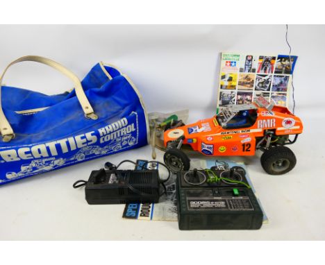 Tamiya - An unboxed and assembled Radio Controlled kit built 1/10th scale Rough Rider #5815. Item appear to be assembled to a