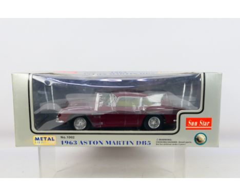 Sun Star - A boxed 1/18 scale 1963 Aston Martin DB5 #1002. Item appear mint in its box. Box appear very good; some storage we