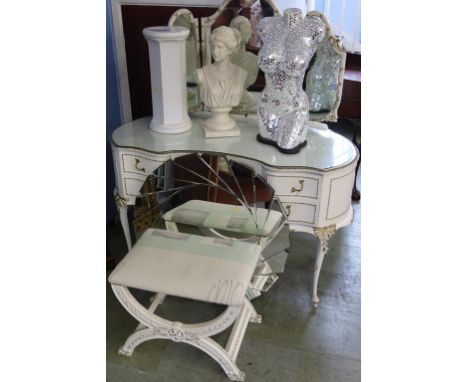 A cream dressing table and stool