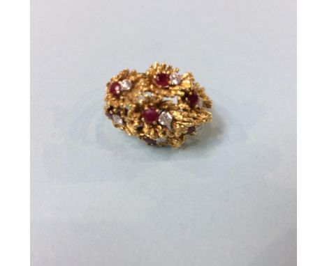 An 18ct diamond and ruby ring, size L/M, 12 grams