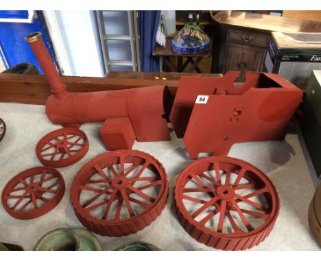 A part metal work traction engine, to include body and wheels