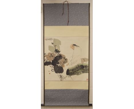 A CHINESE SCROLL PAINTING OF A STYLISED FIGURE amongst flora, image size 66cm x 66cm.