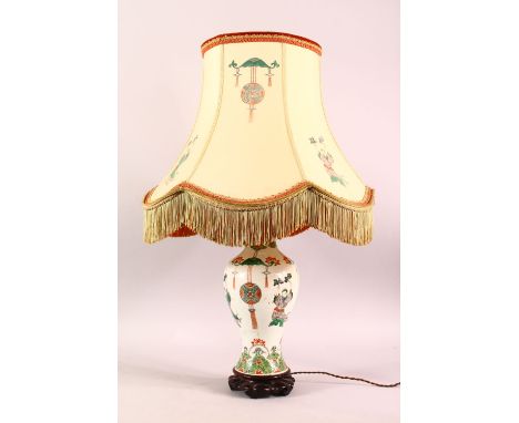 A GOOD CHINESE FAMILLE VERTE PORCELAIN LAMP / VASE, the vase painted with figures and floral motifs, includes shade with simi