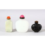A MIXED LOT OF 3 CHINESE CARVED JADE SNUFF BOTTLES - each of varying medium and style - one carved