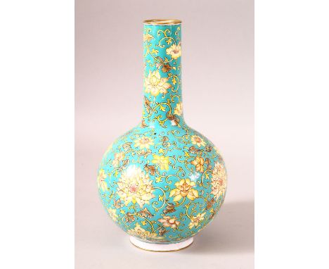 A GOOD DECORATIVE CHINESE TURQUOISE GROUND ENAMEL VASE, with flowers and foliate design, 22.5cm high.