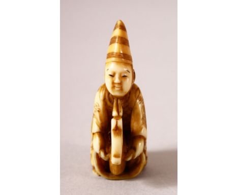 A JAPANESE MEIJI PERIOD CARVED IVORY NETSUKE - BOY &amp; HOBBY HORSE - the boy depicted riding upon his hobby horse, signed "