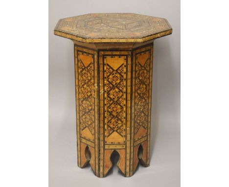 A 18TH/19TH CENTURY SYRIAN INLAID OCTAGONAL WOODEN TABLE, the top inlaid with exotic timbers and mother of pearl, the side pr