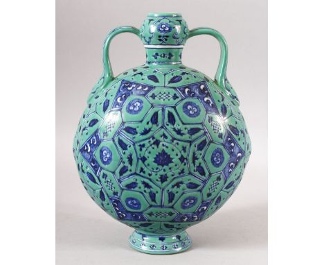 A CHINESE TURQUOISE GROUND TWIN HANDLE PORCELAIN MOON FLASK - the body decorated with geometric flora - the base with a mark.