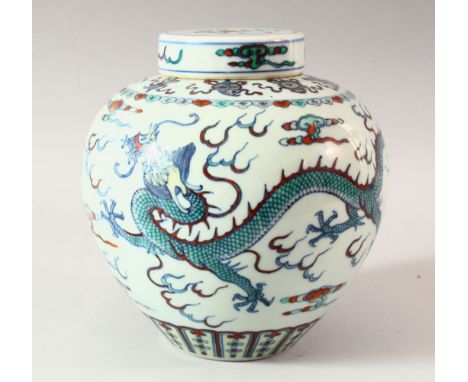 A GOOD 19TH CENTURY CHINESE DOUCAI DECORATED PORCELAIN GINGER JAR &amp; COVER - decorated with scenes of dragons chasing the 