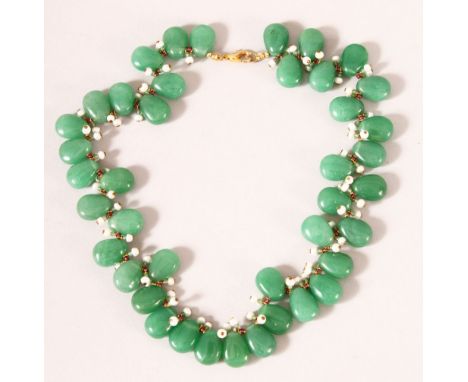 A CHINESE JADEITE AND SEED PEARL NECKLACE, each stone approx. 15mm.