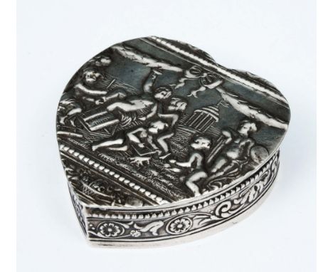 A CONTINENTAL HEART SHAPED SNUFF BOX decorated with cherubs in relief, 5cm long, with Chester import mark for 1912 and stampe