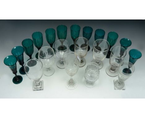 A COLLECTION OF TWELVE 19TH CENTURY GREEN GLASS WINES, together with a 19th Century glass rummer, with engraved decoration, m