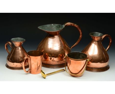 THREE GRADUATED COPPER MEASURES, gallons, half-gallons and quart, two further copper items and a brass ladle