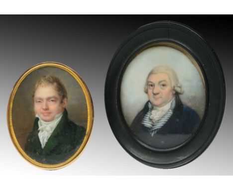 AN EARLY 19TH CENTURY MINIATURE PORTRAIT of a smiling gentleman with bottle green top coat and white stock in gilt frame, 6.5