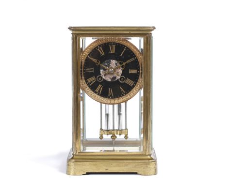 A FRENCH FOUR GLASS AND BRASS CASED LIBRARY MANTEL CLOCK with circular black enamel dial, striking mechanism and mercury pend