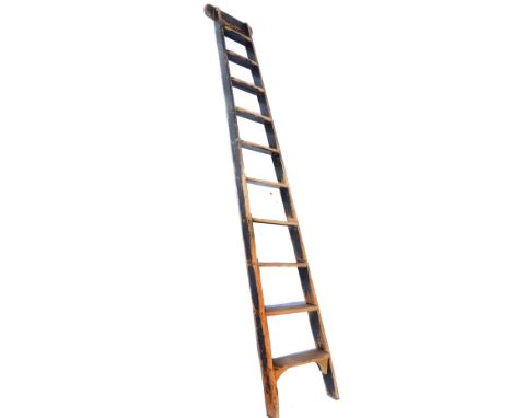 AN OLD PINE TEN TREAD SHOP LADDER, 243cm high