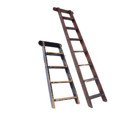 AN OLD PINE SEVEN TREAD SHOP LADDER, 170cm long and another four tread, 102cm high (2)