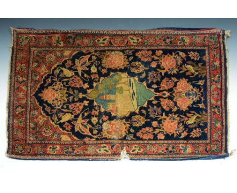 AN OLD PERSIAN BLUE GROUND MAT with central architectural motif within a foliate ground (tears), 89 x 62cm