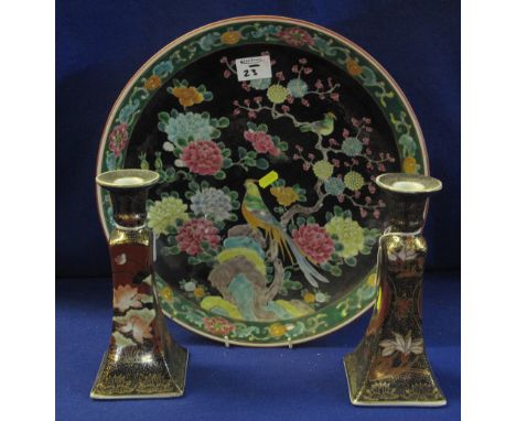 Japanese porcelain charger with overall coloured enamel decoration of fantastic birds amongst foliage on a black ground, toge