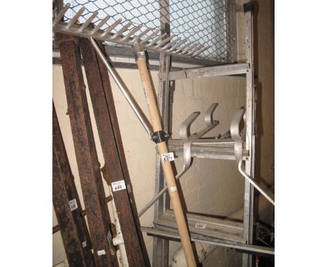 Aluminium folding ladder together with an aluminium ladder stand off by Abru and a modern garden rake. (3)(B.P. 24% incl. VAT