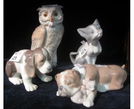 Four Spanish porcelain animal studies to include: Lladro and Nao cat, dog and owl figures. (4)(B.P. 24% incl. VAT)