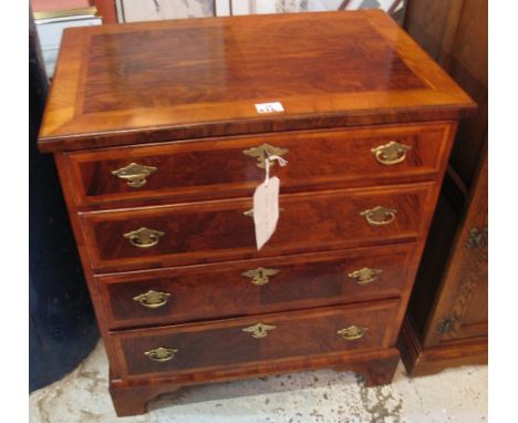 Early 20th Century walnut narrow straight fronted chest of four drawers on bracket feet.(B.P. 24% incl. VAT)