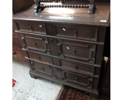 Oak Jacobean style straight front chest of four long drawers on bracket feet. (B.P. 24% incl. VAT)