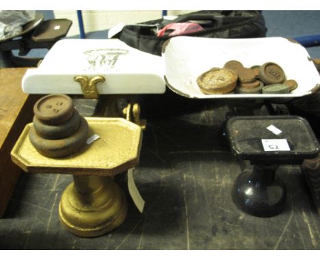 Two sets of cast iron scales with various cast iron weights.(B.P. 24% incl. VAT)