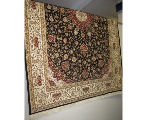 Middle Eastern floral silk carpet overall with intricate trailing flower head designs on a blue ground within a banded border