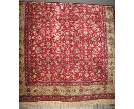 Cashmeri red ground floral carpet.(B.P. 24% incl. VAT)