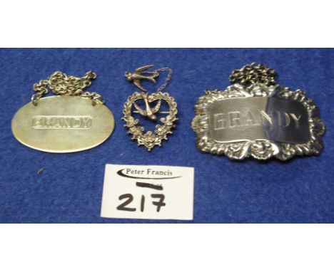 Two silver brandy decanter labels together with silver bird and heart design bar brooch.(B.P. 24% incl. VAT)