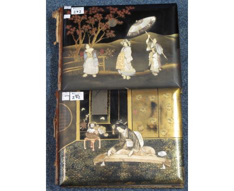 Two Japanese folios containing assorted colour prints of landscapes, interiors etc. The covers textured and inlaid with mothe