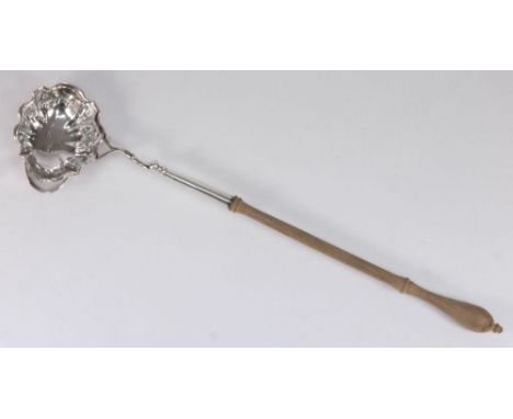 A Georgian silver punch ladle, all marks worn and rubbed:, the shaped bowl with scroll mount and turned wood handle, 40 cm. l