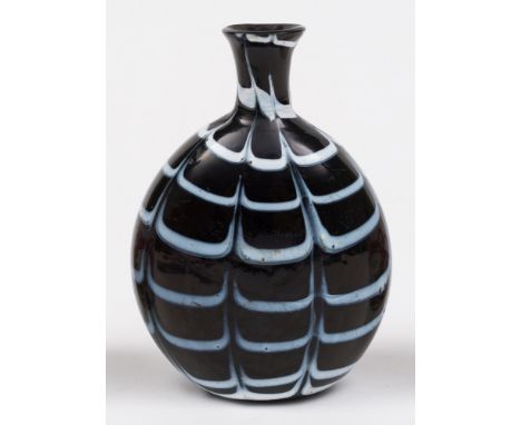 An 18th century Continental amethyst glass flask: of flattened ovoid form with slender neck, applied and combed with opaque w