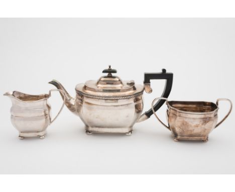 An Elizabeth II silver three-piece tea service, maker EHP Co Ltd, Sheffield, 1973: of barge shaped outline with canted corner