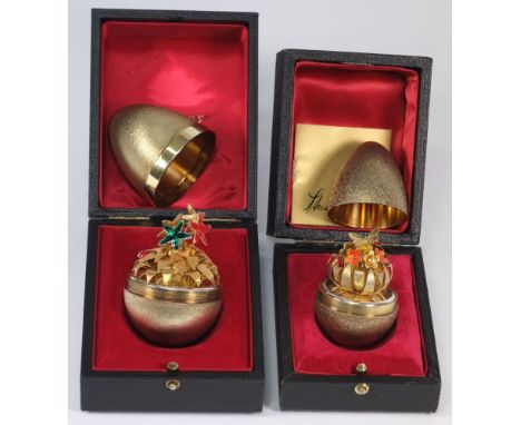 A Stuart Devlin silver-gilt egg, London 1981:,  the interior with a butterfly upon a flowering shrub with enamel decoration, 